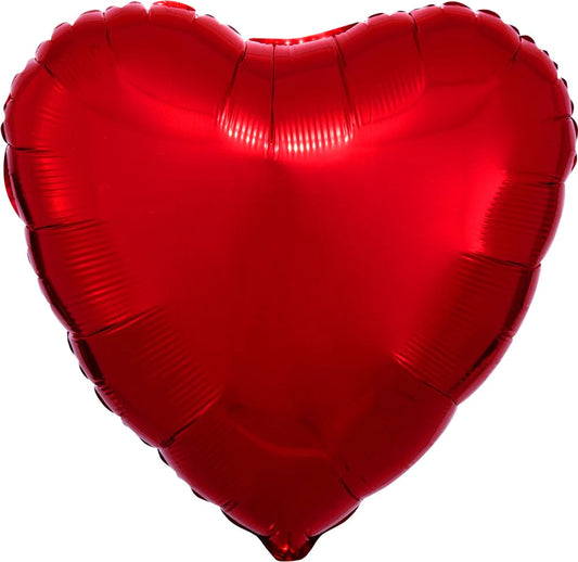 A red heart-shaped mylar balloon