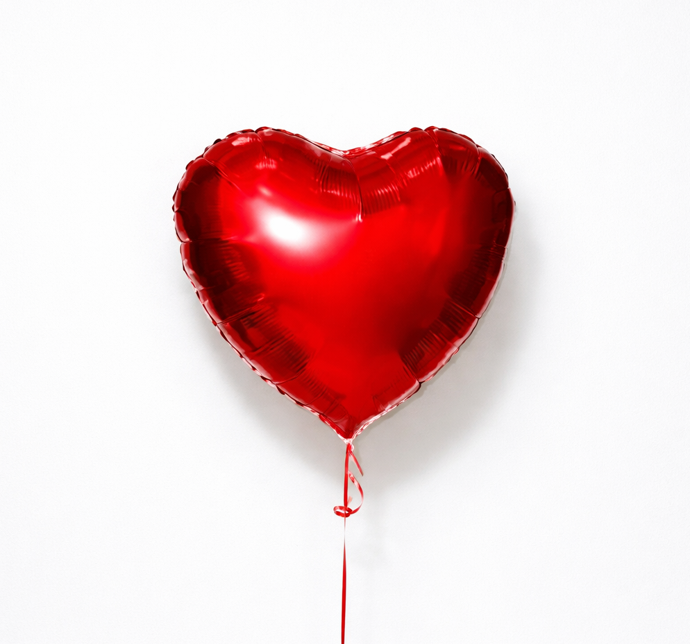 Red heart-shaped balloon on a white background